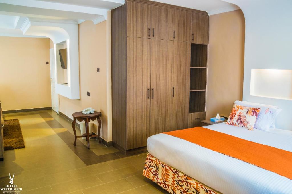 Postel nebo postele na pokoji v ubytování Hotel Waterbuck