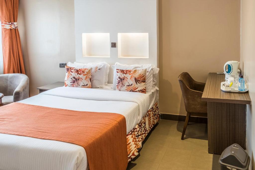 Postel nebo postele na pokoji v ubytování Hotel Waterbuck