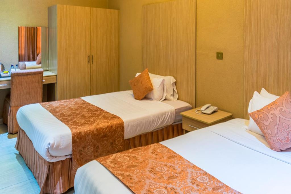 Postel nebo postele na pokoji v ubytování Hotel Waterbuck