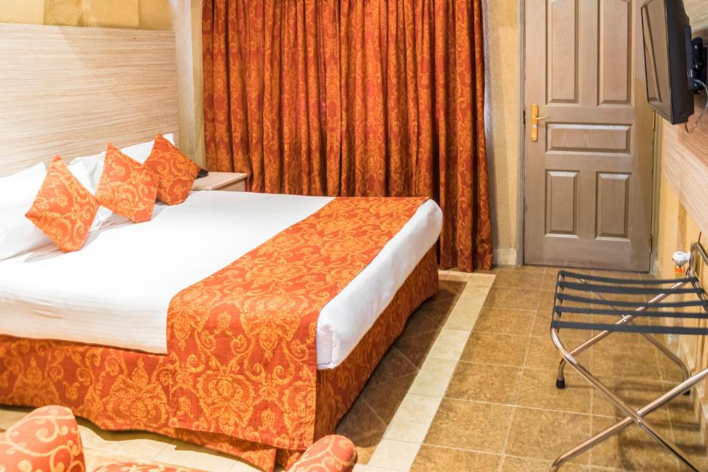 Postel nebo postele na pokoji v ubytování Hotel Waterbuck