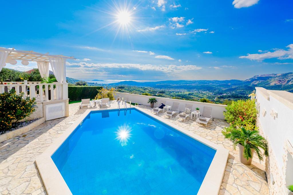 a swimming pool in a villa with a view at Lovely Lucia's house in Dubrovnik