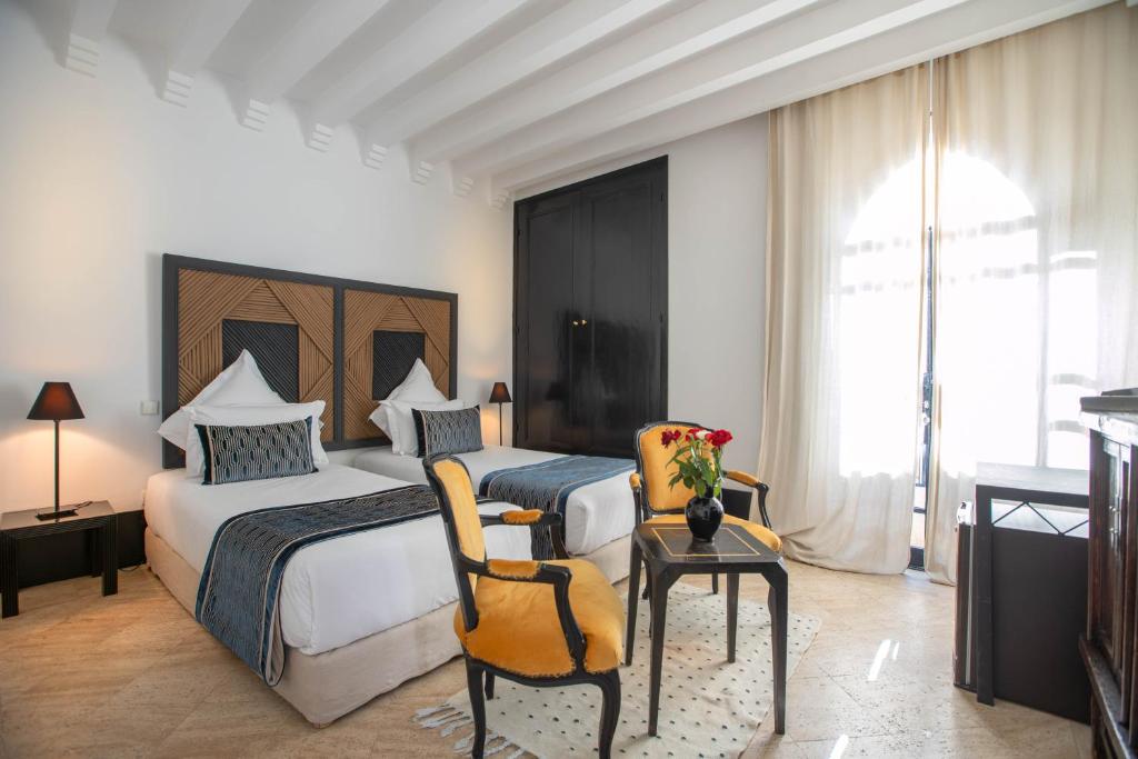 Postel nebo postele na pokoji v ubytování Riad & Spa Azzouz