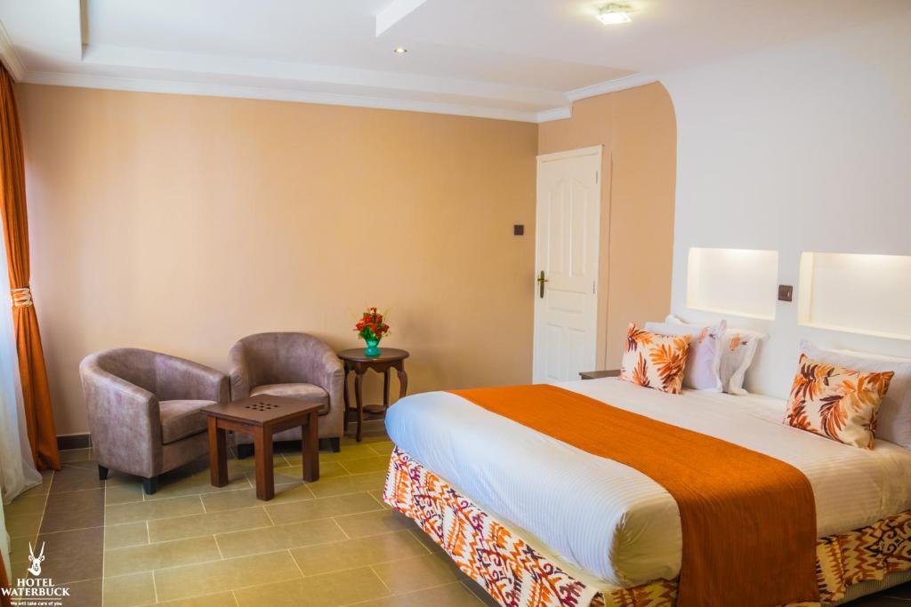 Postel nebo postele na pokoji v ubytování Hotel Waterbuck