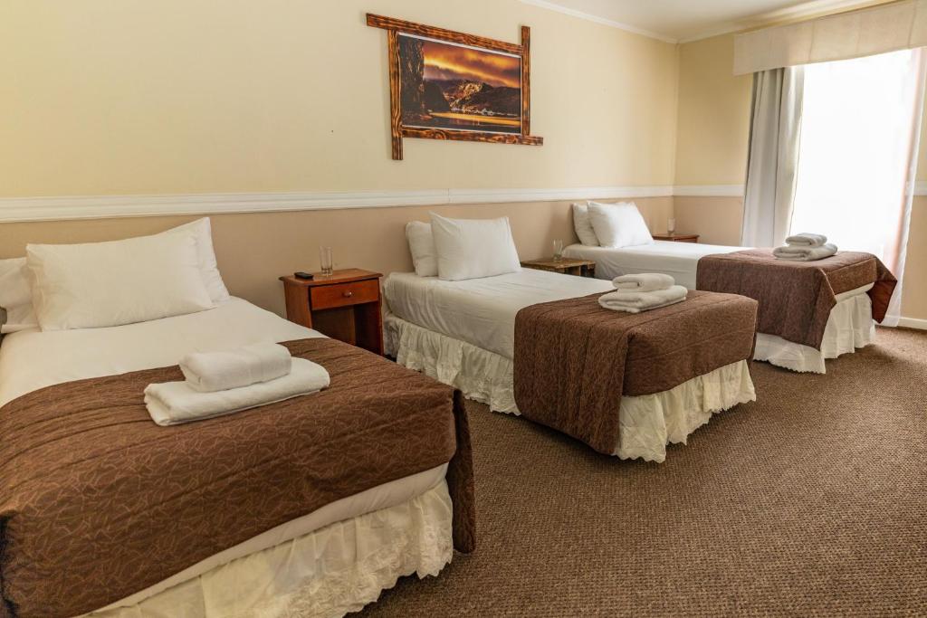 Postel nebo postele na pokoji v ubytování Darwin Hotel