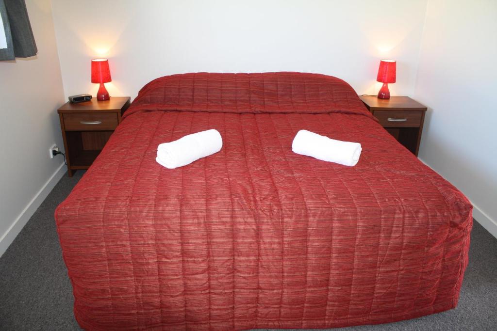 Un ou plusieurs lits dans un hébergement de l'établissement Oxford Court Motel