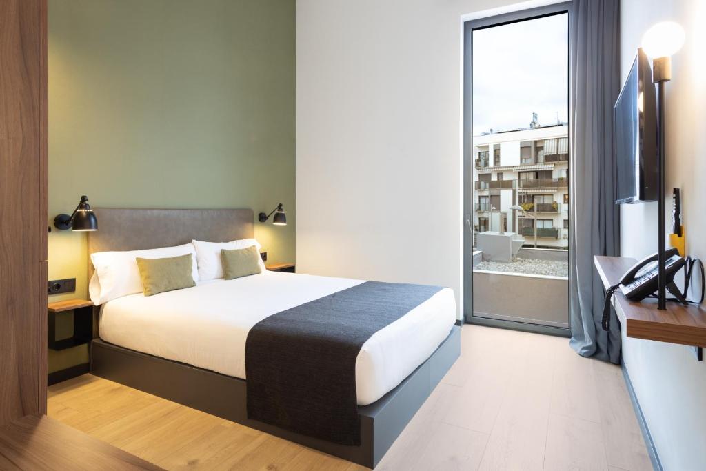Posteľ alebo postele v izbe v ubytovaní Hotel Orangine