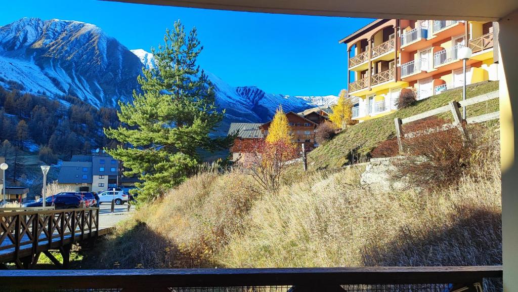 a view of the mountains from a window of a building at La Foux d'Allos - Studio 4 pers. in Allos