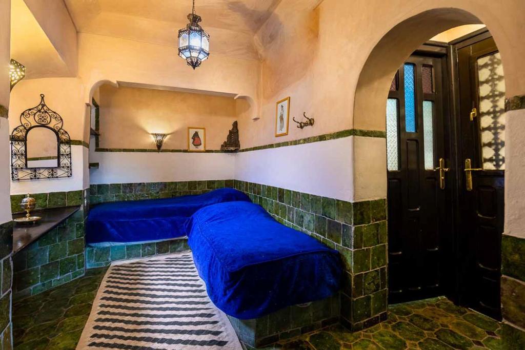 Postel nebo postele na pokoji v ubytování Hôtel Riad Dar Daïf