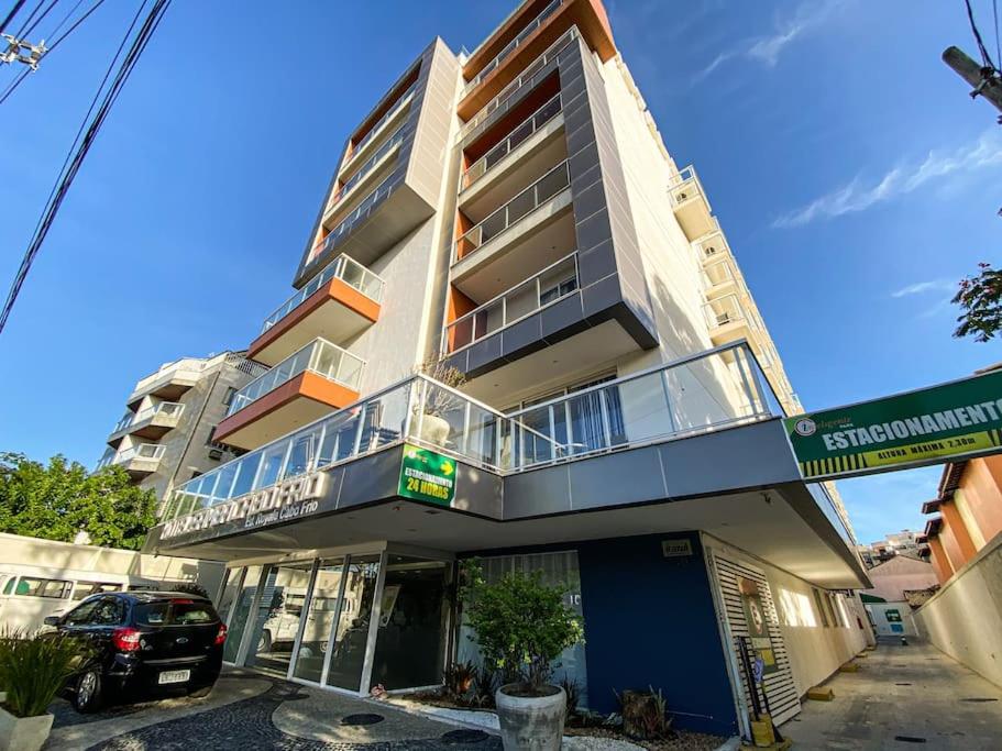 a building with a car parked in front of it at Cabo Frio - Loft Premium Royalle in Cabo Frio