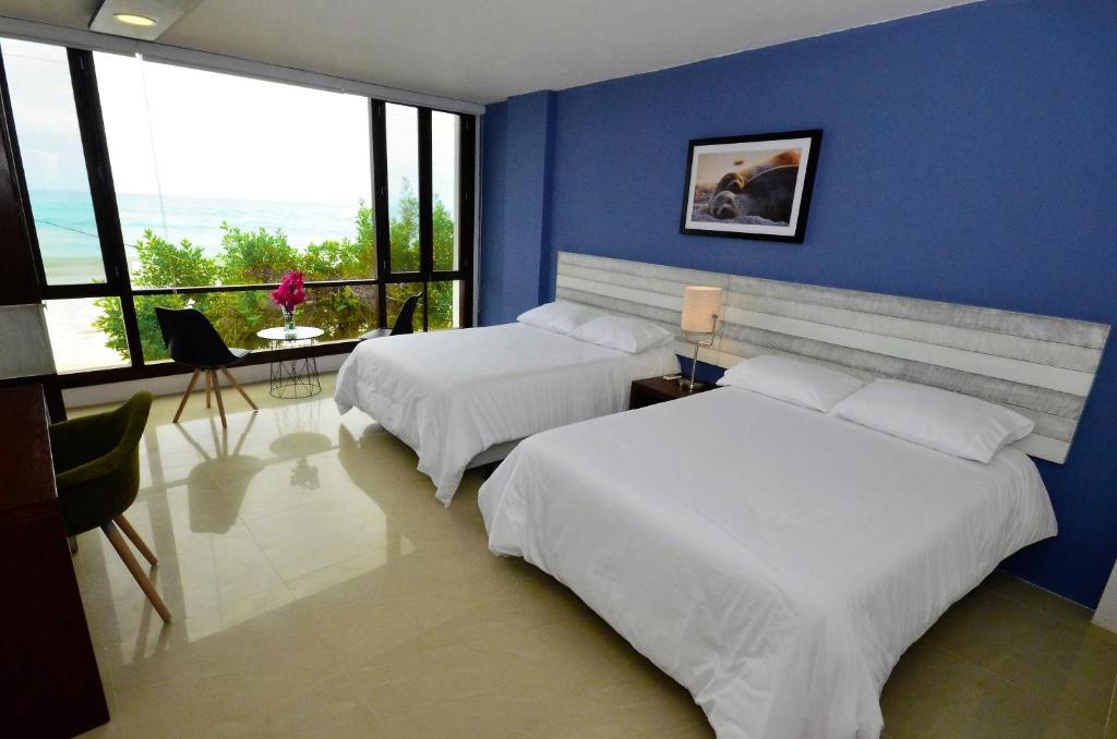 Postel nebo postele na pokoji v ubytování Casita de la Playa