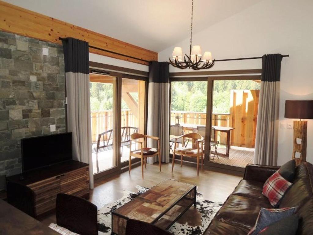 a living room with a couch and a table at Appartement Châtel, 4 pièces, 6 personnes - FR-1-198-195 in Châtel