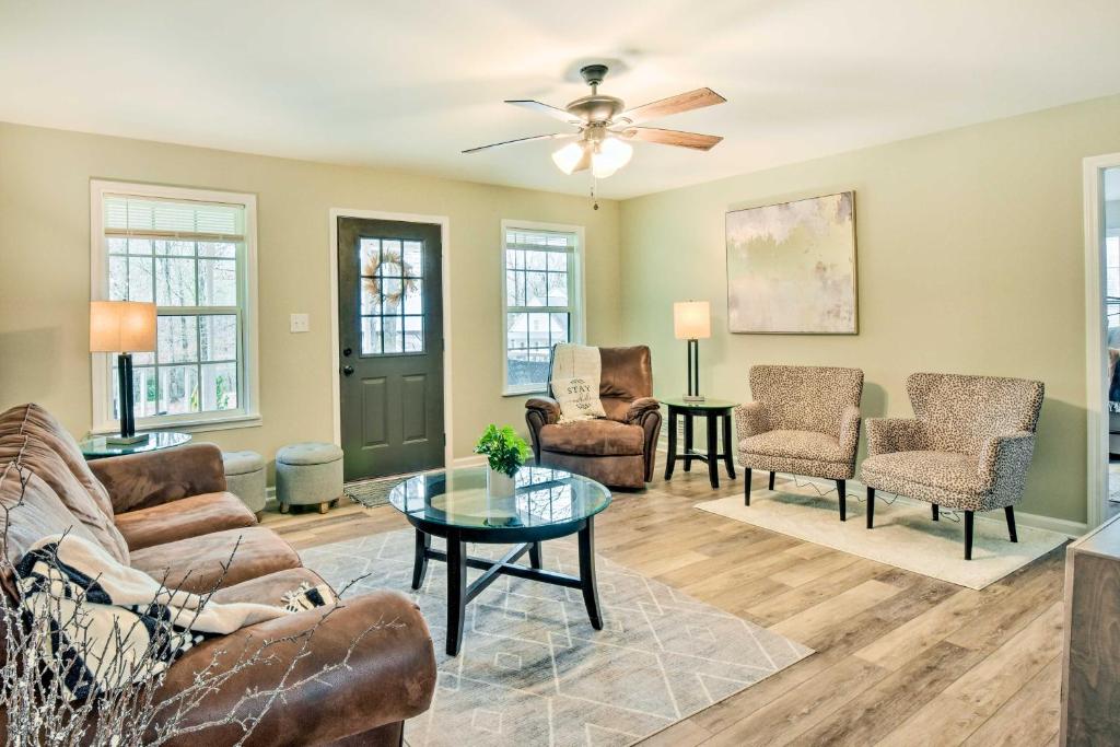 a living room with furniture and a ceiling fan at Beautiful Clarkesville Home about 8 Mi to Helen! in Clarkesville