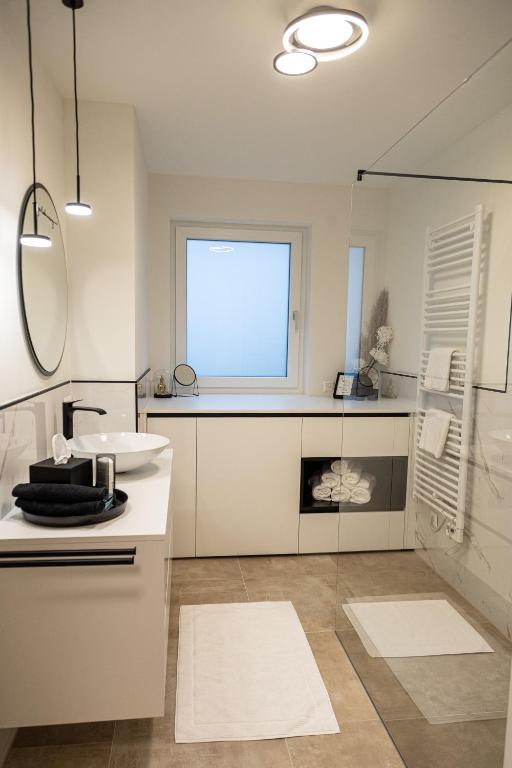 Kuchyň nebo kuchyňský kout v ubytování Ferienwohnung Deluxe Sattendorf