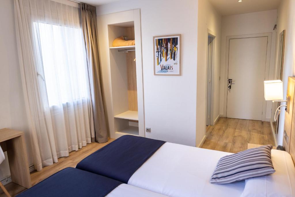 Postel nebo postele na pokoji v ubytování Hotel Terminus