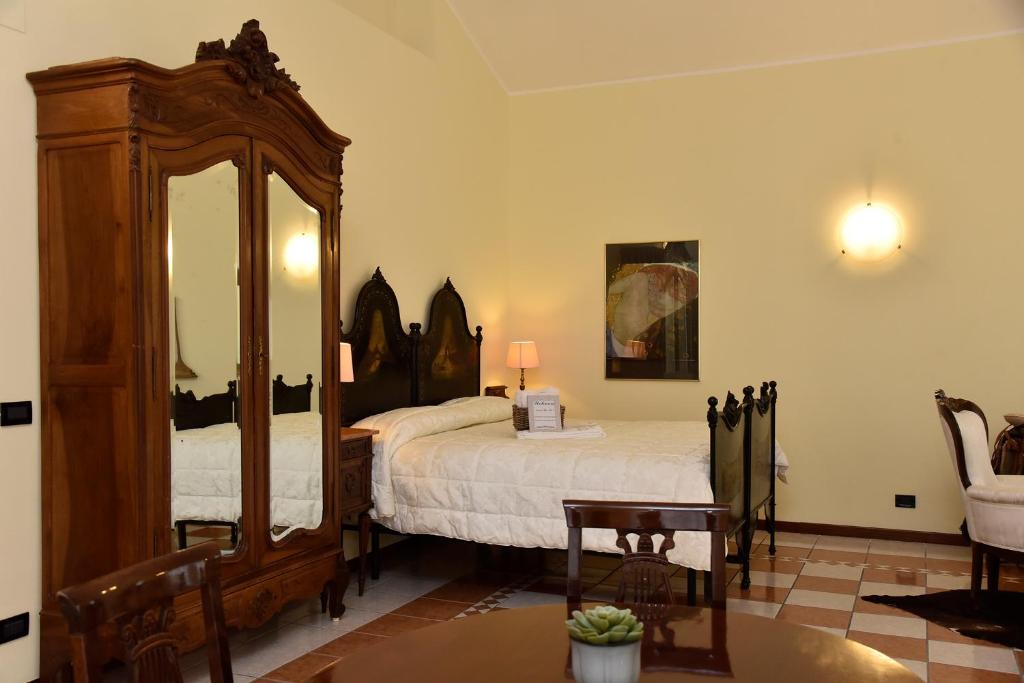 Posteľ alebo postele v izbe v ubytovaní Agriresort Villa Bentivoglio