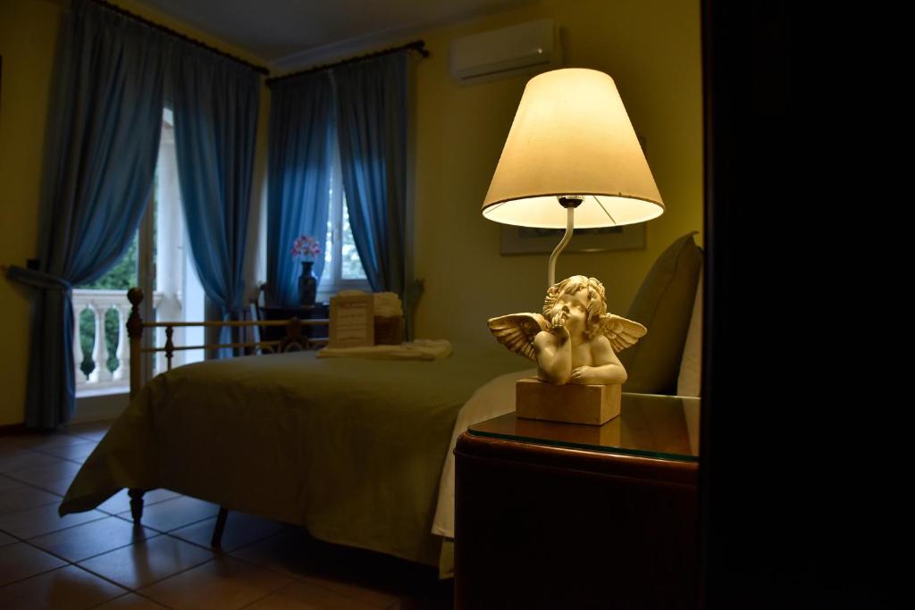 Posteľ alebo postele v izbe v ubytovaní Agriresort Villa Bentivoglio