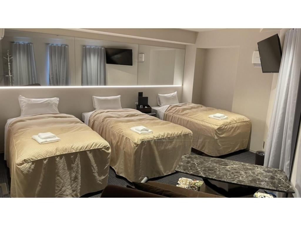 a hotel room with two beds and a tv at Hotel Wisteria NARA - Vacation STAY 99258v in Nara