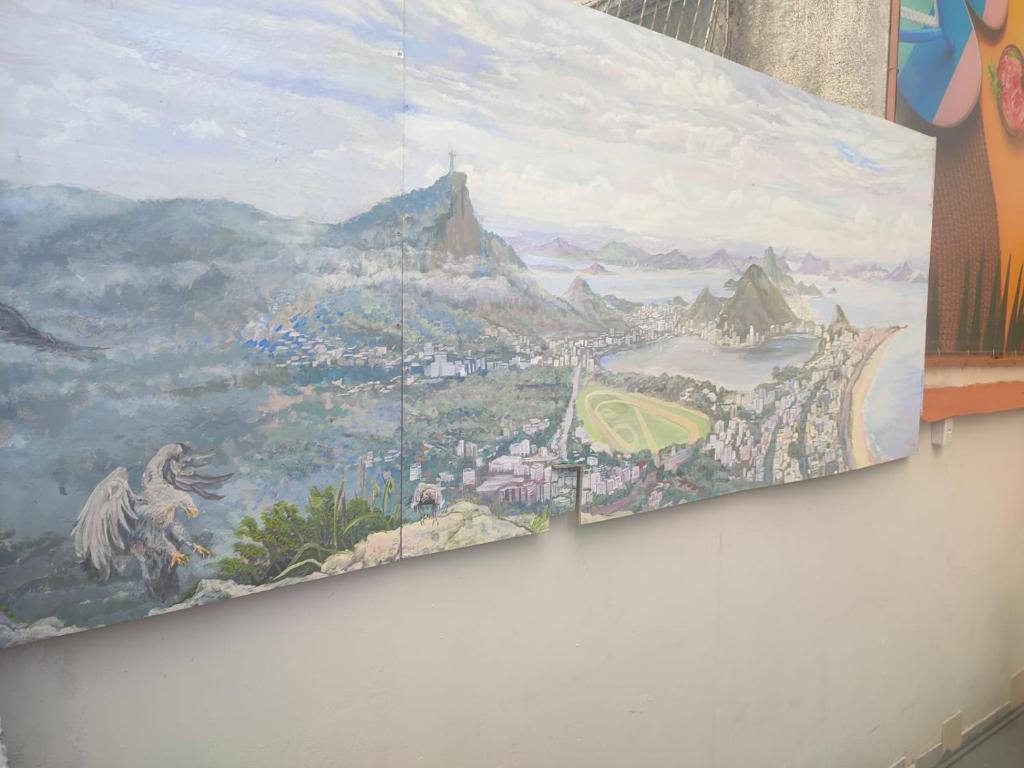 a painting hanging on a wall in a room at Hostel Princess Copacabana in Rio de Janeiro