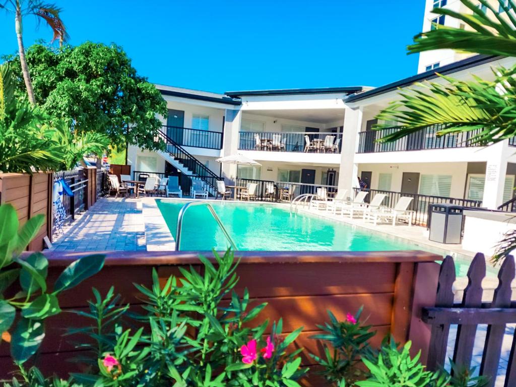 a swimming pool in front of a building at Devon Shores in Clearwater Beach