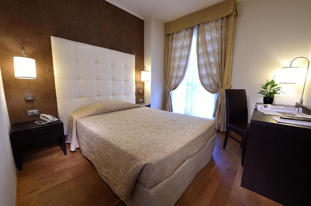 Postel nebo postele na pokoji v ubytování Hotel Rioverde