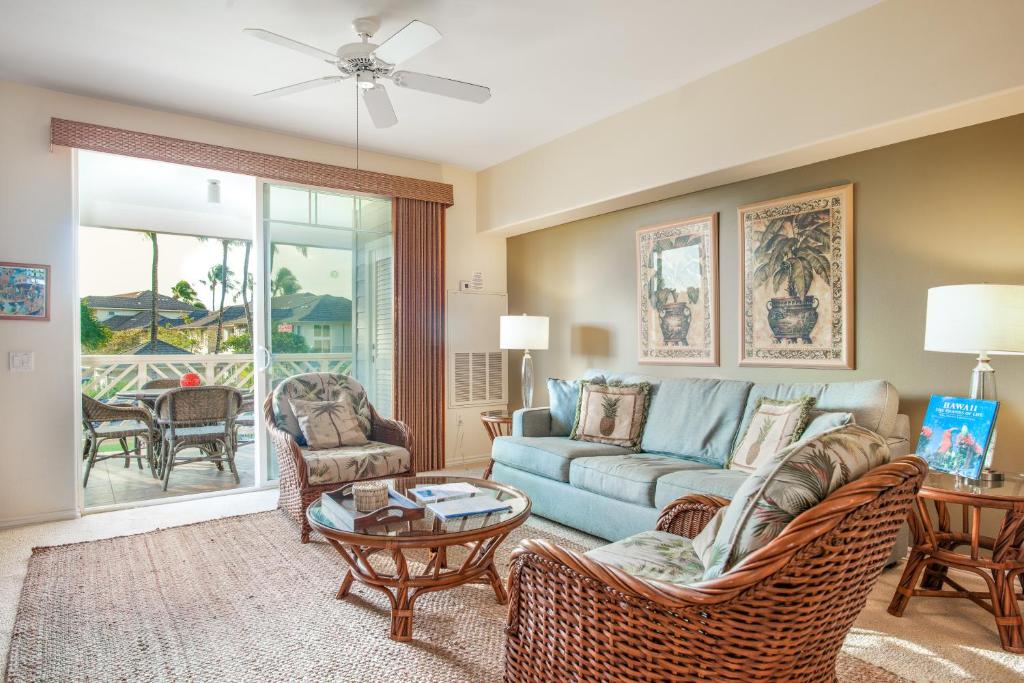 a living room with a couch and chairs at Waikoloa Fairway Villas #L22 in Waikoloa