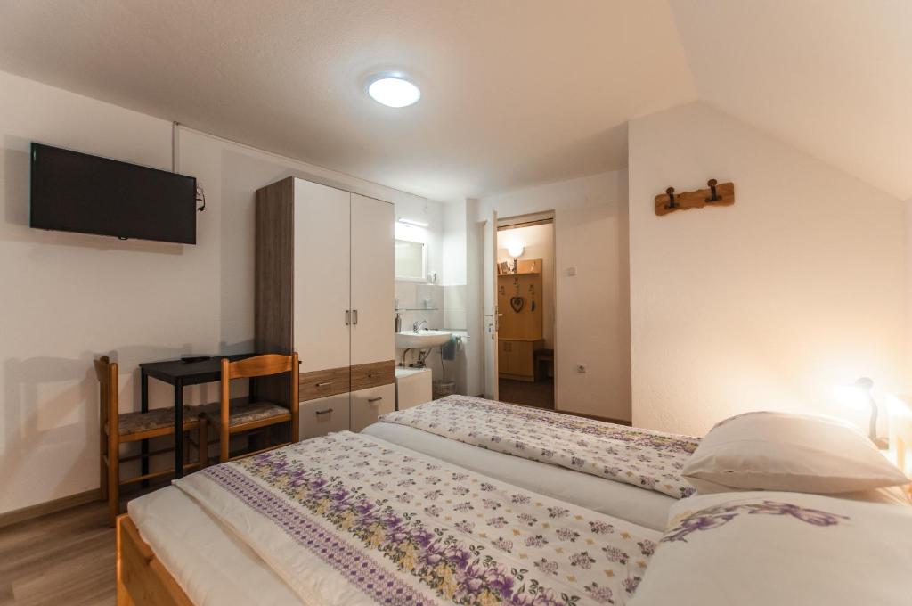 Postel nebo postele na pokoji v ubytování Apartment Ticar