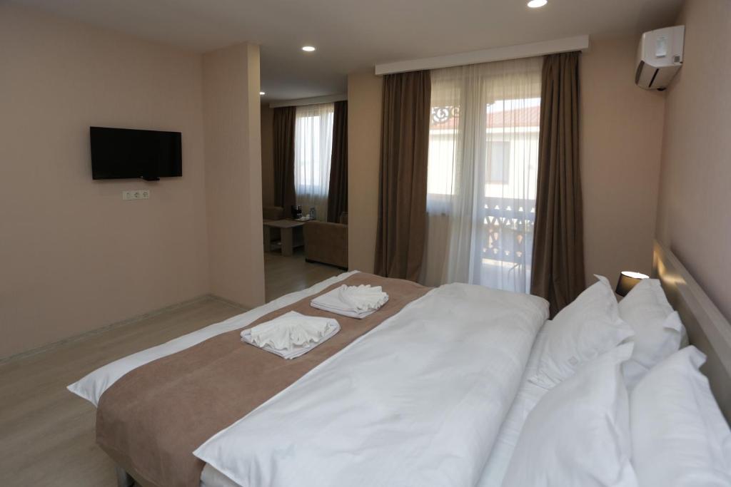 Postel nebo postele na pokoji v ubytování Royal Green Hotel