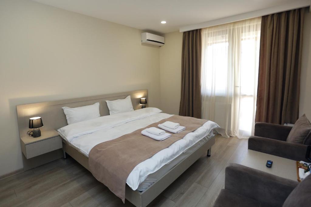 Postel nebo postele na pokoji v ubytování Royal Green Hotel