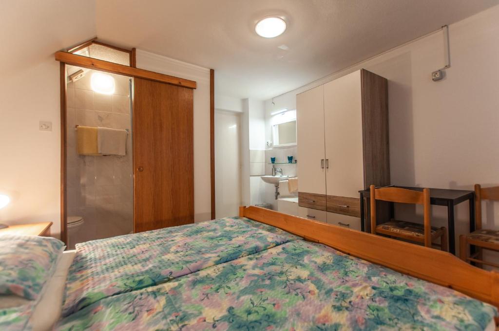 Postel nebo postele na pokoji v ubytování Apartment Ticar