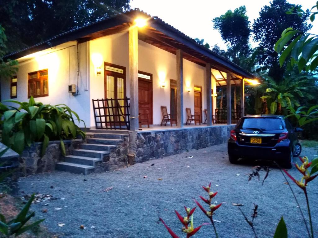 a car parked in front of a house at SKY Clouds Residencies Hikkaduwa in Hikkaduwa