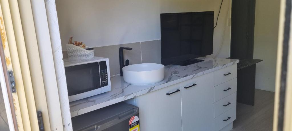 Kuchyň nebo kuchyňský kout v ubytování Buderim Fiesta Motel