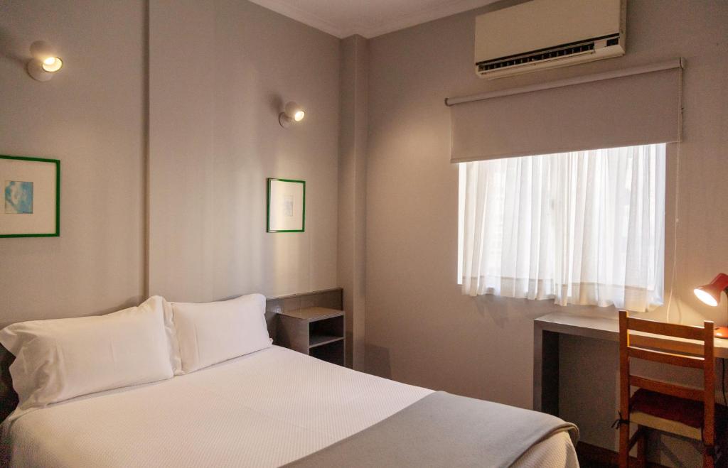 Postel nebo postele na pokoji v ubytování Hotel Sao Nicolau