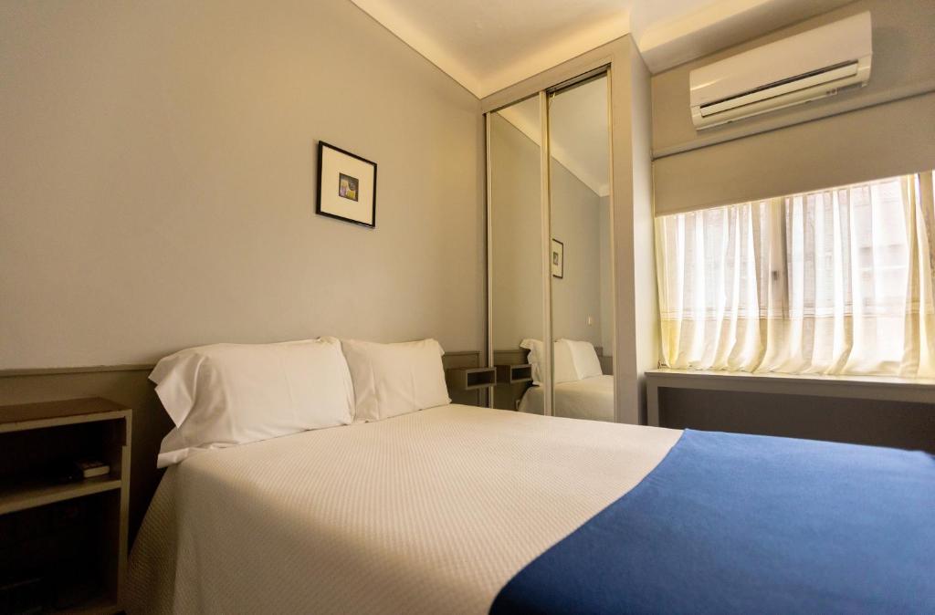 Postel nebo postele na pokoji v ubytování Hotel Sao Nicolau