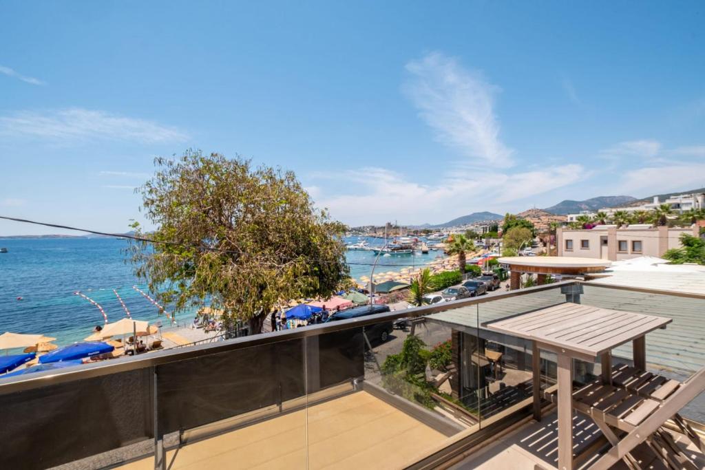 a balcony with a view of the water at Seafront Flat with Breathtaking Sea View in Bodrum in Bodrum City