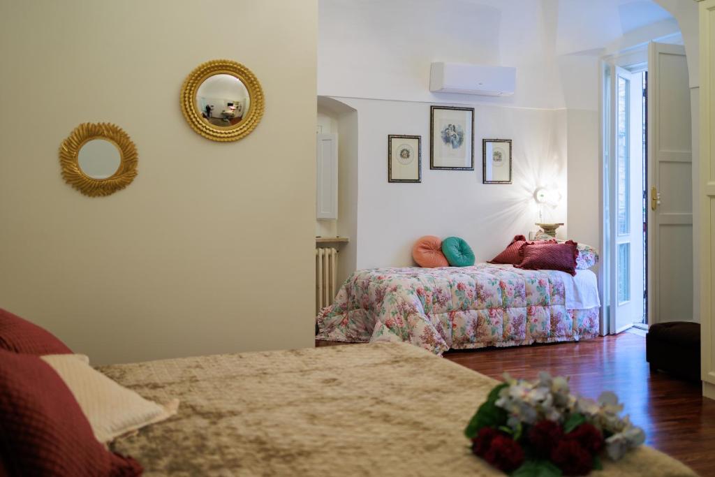 A bed or beds in a room at B&B CORSO VITTORIO