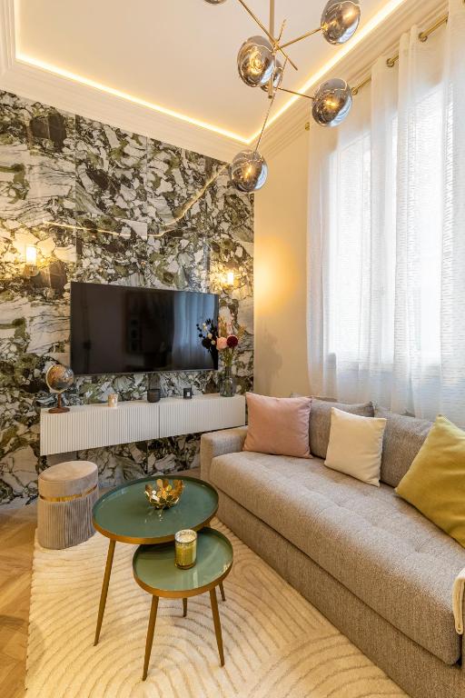Televízia a/alebo spoločenská miestnosť v ubytovaní le studio des Champs elysees