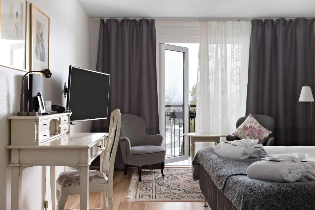TV a/nebo společenská místnost v ubytování Best Western Gustaf Froding Hotel & Konferens
