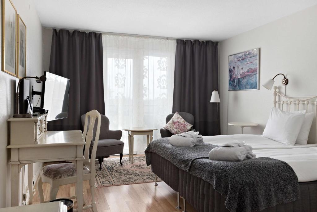 Postel nebo postele na pokoji v ubytování Best Western Gustaf Froding Hotel & Konferens