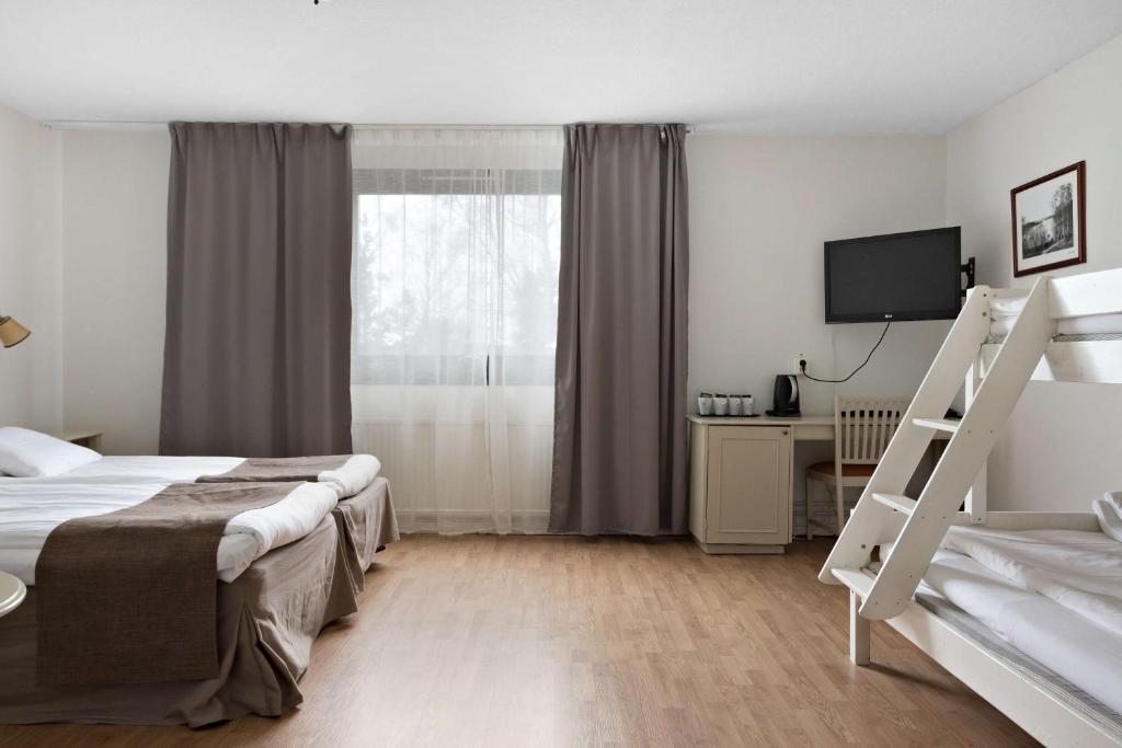 Postel nebo postele na pokoji v ubytování Best Western Gustaf Froding Hotel & Konferens