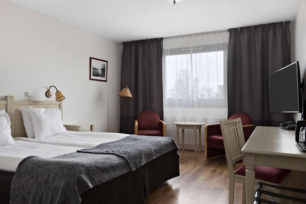 Postel nebo postele na pokoji v ubytování Best Western Gustaf Froding Hotel & Konferens