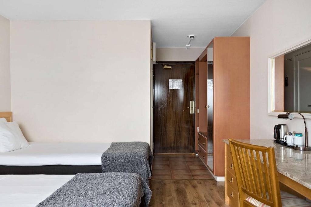 Postel nebo postele na pokoji v ubytování Best Western Gustaf Froding Hotel & Konferens