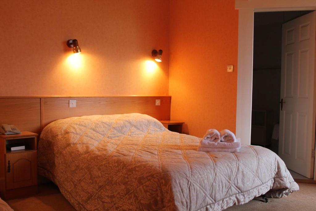 Postel nebo postele na pokoji v ubytování Riversdale Farm B&B