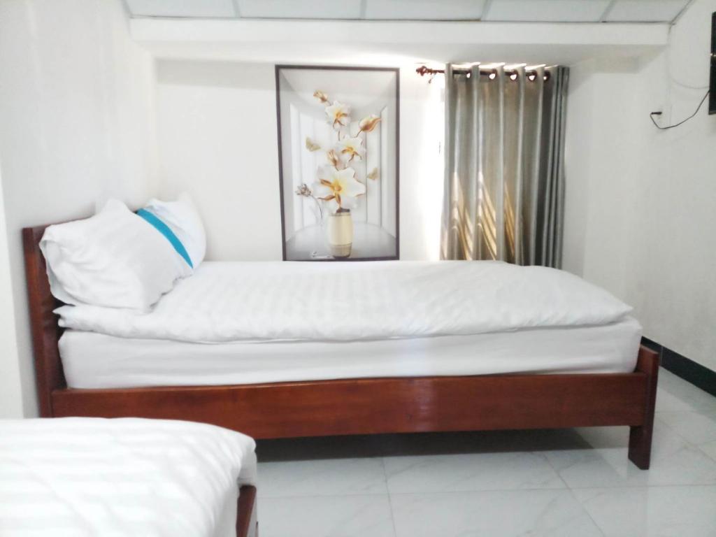 Postel nebo postele na pokoji v ubytování BOBE Homestay