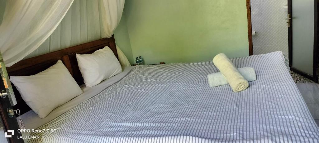 Postel nebo postele na pokoji v ubytování The Pondok