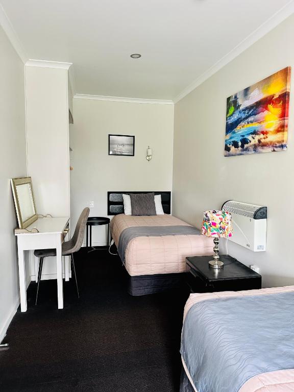 Postel nebo postele na pokoji v ubytování A1 Kaikoura Motel & Apartment