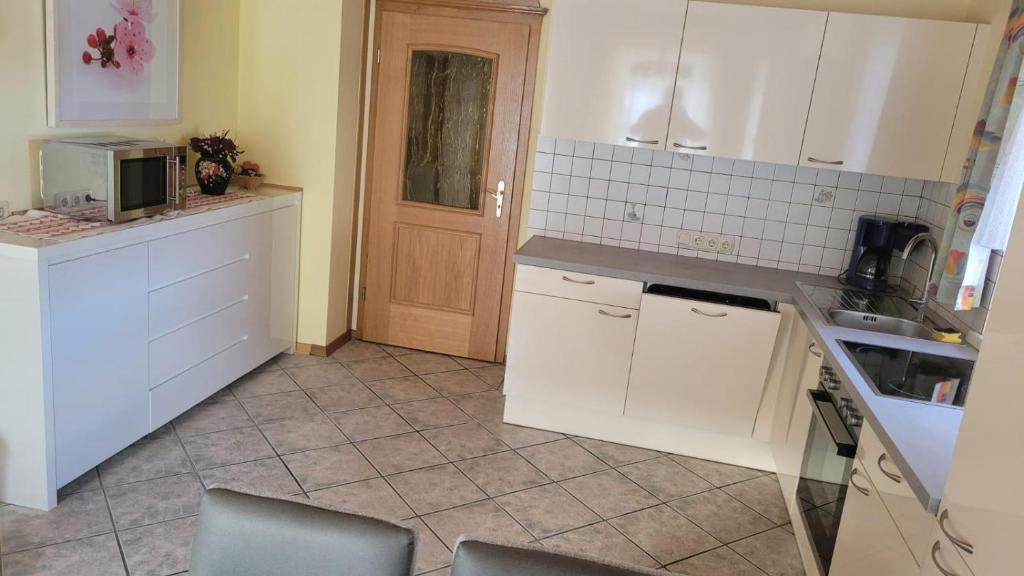Kuchyň nebo kuchyňský kout v ubytování Gästehaus Raab