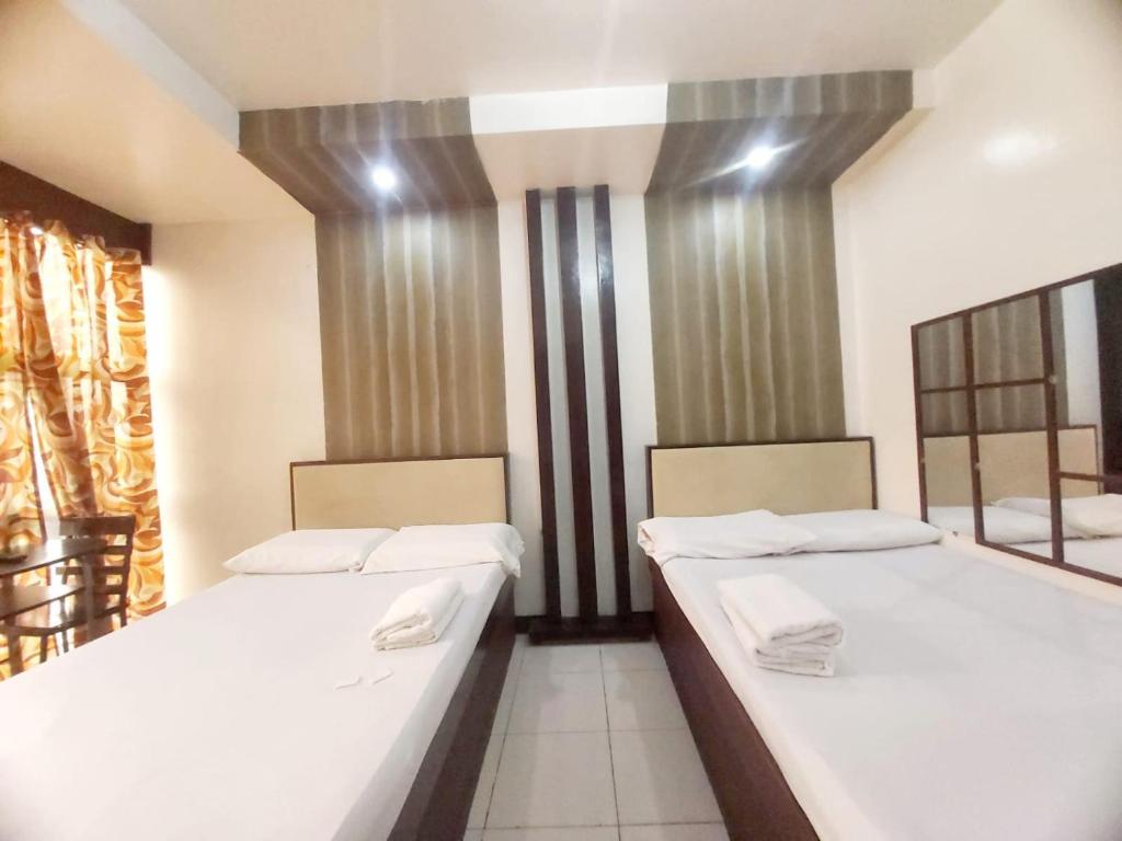 Postel nebo postele na pokoji v ubytování Cosmo Hotel Espana Near Ust