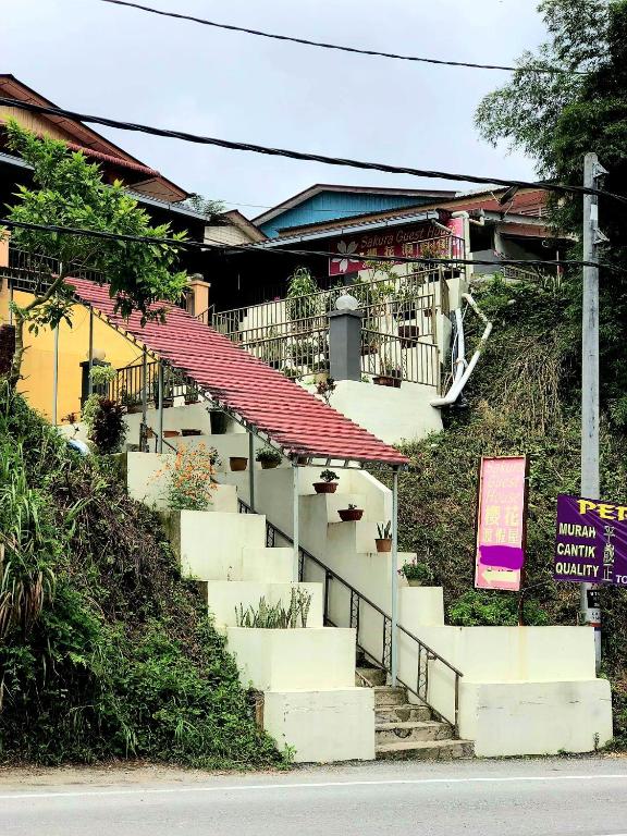 a group of stairs on the side of a building at Sakura Guest House in Cameron Highlands