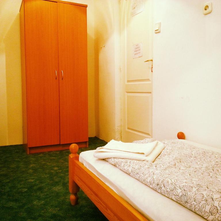 Posteľ alebo postele v izbe v ubytovaní Carmen Pension