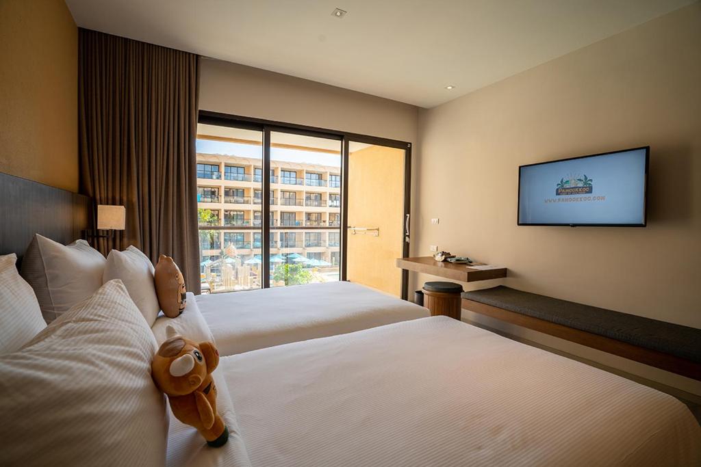 Ein Bett oder Betten in einem Zimmer der Unterkunft Pamookkoo